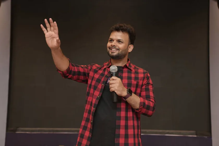 Samir Dash speaking on stage